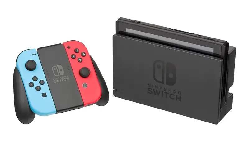 Nintendo Switch рядом с оригинальной док-станцией